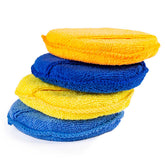Cuatro esponjas de pulido de microfibra en distintos colores